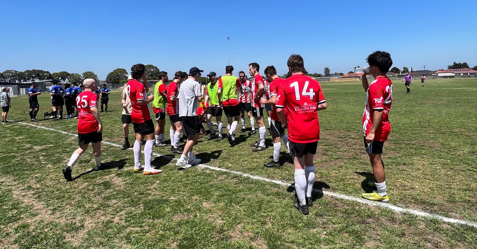 Swinburne players regroup during the 2023 cup tie at Lyndale United
